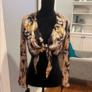 Urban Outfitters Black and Orange patterned tie blouse.